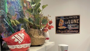 A kitchen with a microwave, coffee maker, and a decorative red bowl on a shelf. - Maisonnette (Wintzenheim)