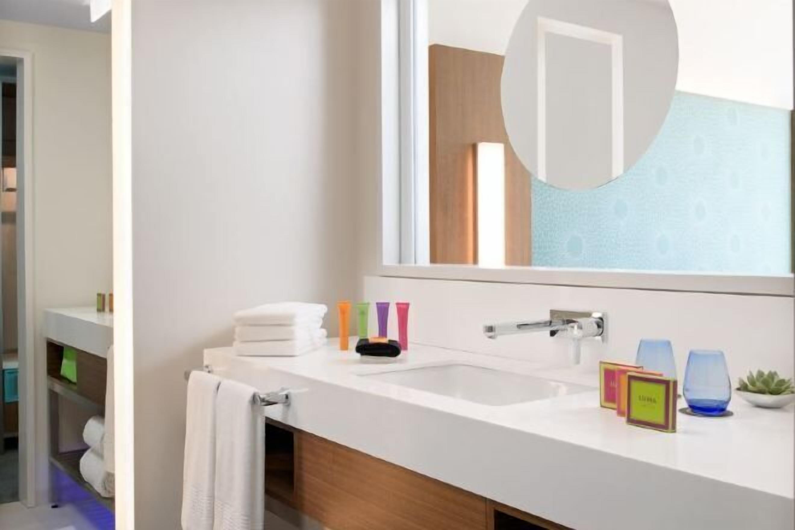 Designer toiletries, hair dryer, bathrobes, towels