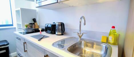 Fridge, microwave, toaster, dining tables