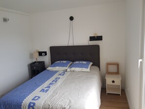 1 bedroom, desk, iron/ironing board, travel crib