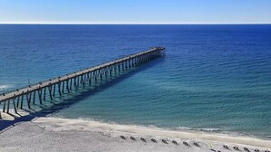 A pier extending into the ocean with a beach in the foreground. - Newly remodeled and close to everything you need at Sea Glass Serenity.  (Navarre)