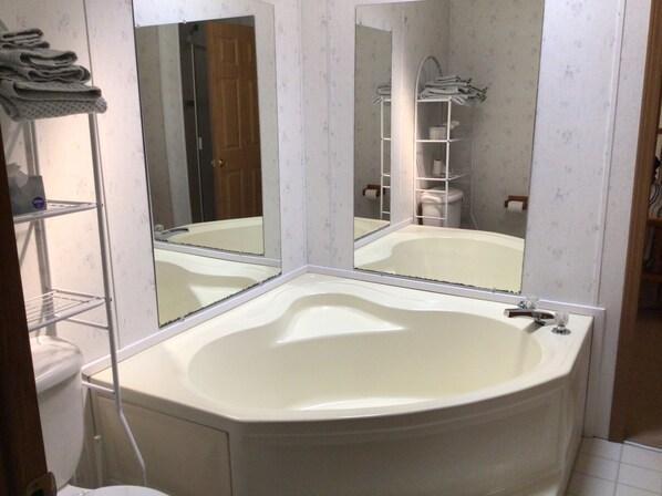 Combined shower/tub, towels, soap, shampoo