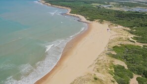 On the beach, sun loungers, beach towels