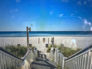 A wooden staircase leading to a beach with a clear sky. - FALL DEAL! 2nd FL! FREE BEACHSETUPS! CALYPSO 3-210 LOW RATES! Pool+Ocean View! (Panama City Beach)