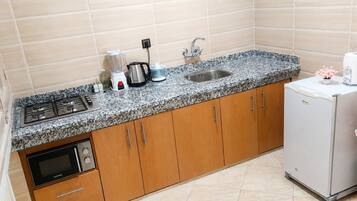 Fridge, microwave, stovetop, coffee/tea maker