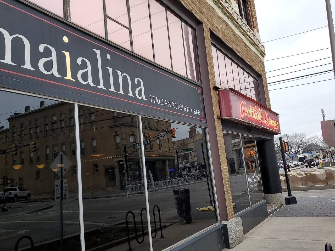 A building with a sign reading "maialina Italian Kitchen + Bar".