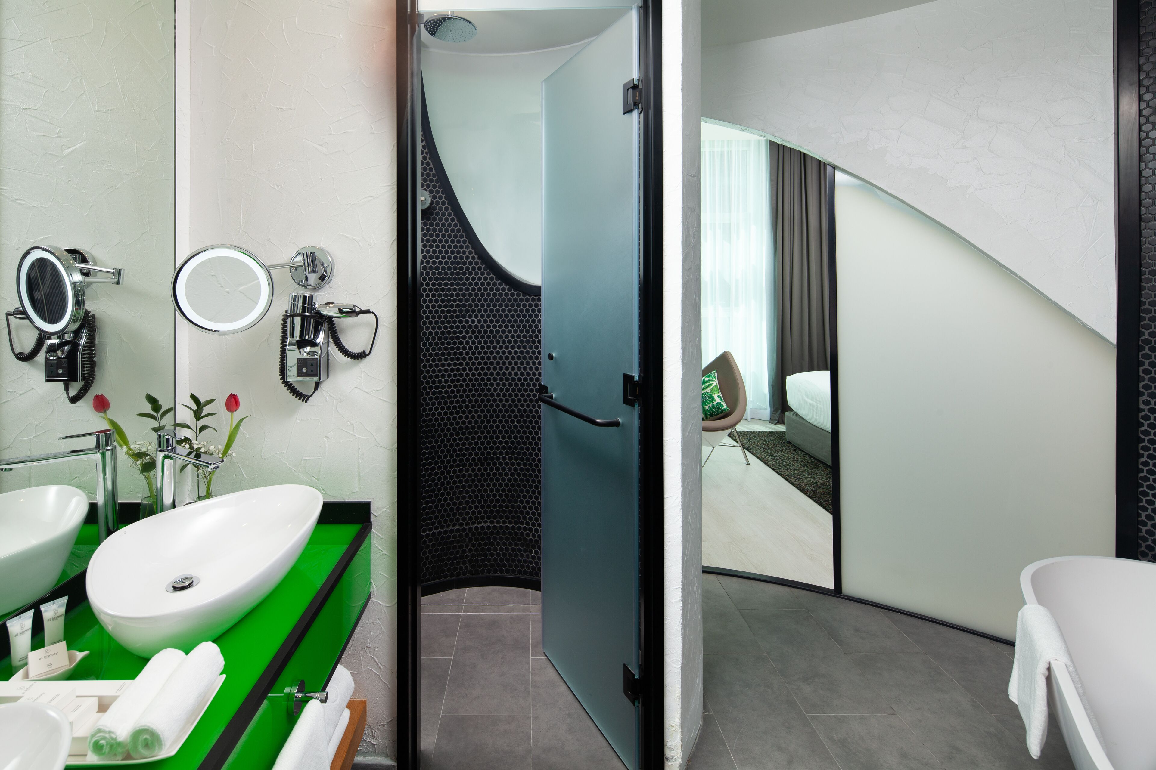 sky garden suite | bathroom | hair dryer, bathrobes, slippers, bidet