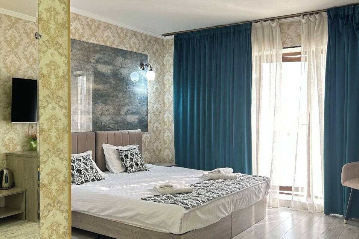 Single Room | Bathroom | Deep soaking tub, rainfall showerhead, hair dryer, slippers