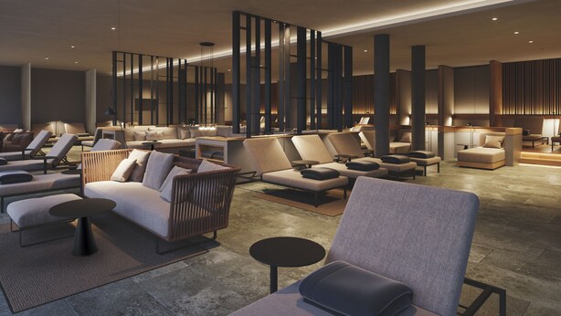 A modern lobby with multiple seating areas, including sofas and chairs, arranged around a central coffee table. - Hotel Breitenburg (Breitenburg)
