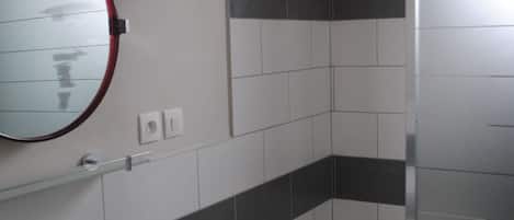 Shower, hair dryer, towels, toilet paper