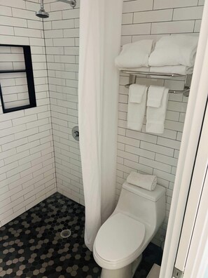 Shower, hair dryer, towels