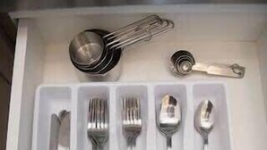 A drawer with neatly organized cutlery including forks, knives, and spoons. - Bardo Loft Suite #201 (Dallas)