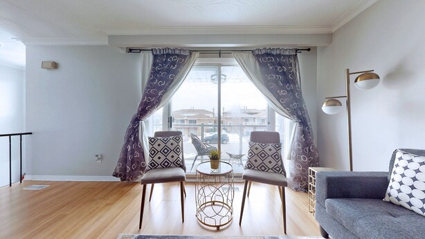 A living room with two chairs, a small table, and a sofa. - CHARMING THREE BEDROOM FLAT (brampton)