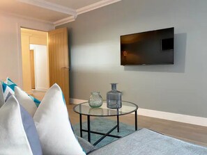 Apartamento Deluxe | Zona de estar