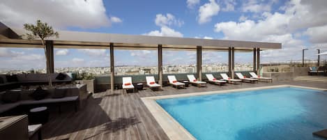 Outdoor pool, open 8:00 AM to 6:00 PM, lifeguards on site