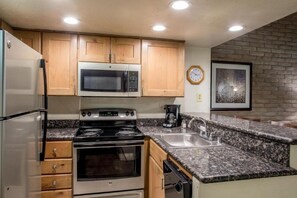 Fridge, stovetop, coffee/tea maker, cookware/dishes/utensils