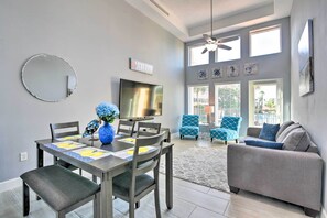 Relax in this stylish living space with a dining area, flat-screen TV, and comfortable seating.