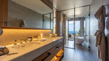 Ocean View Garden Suite,13 years or older, Non Smoking | Bathroom | Separate tub and shower, rainfall showerhead, free toiletries