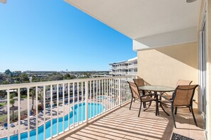 A balcony with a view of a swimming pool and a cityscape. - Destin West Gulfside 506 ~ Amazing Beach and Pool Views! (Fort Walton Beach)