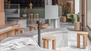 A modern interior with a seating area, a bar, and a view of the outside. - Buckle Street Studios by Locke, Aldgate (London)