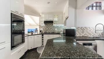 Coffee/tea maker, fridge, microwave, oven