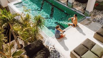 2 outdoor pools, open 9:00 AM to 10:00 PM, pool loungers