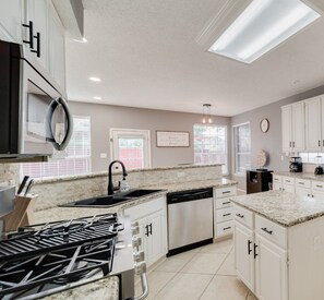 Fridge, microwave, oven, stovetop - Grand 6BR/2.5B Home with Pool, Grill & Game Room (Grand Prairie)