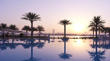 Indoor pool, outdoor pool, open 7:00 AM to 6:00 PM, pool umbrellas