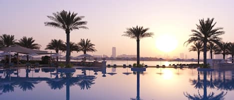 Indoor pool, outdoor pool, open 7:00 AM to 6:00 PM, pool umbrellas