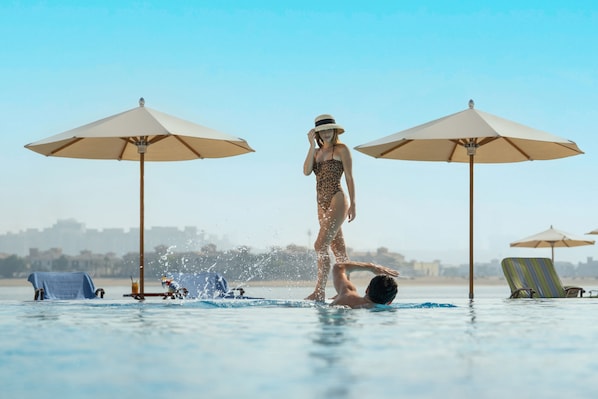 Indoor pool, outdoor pool, open 7:00 AM to 6:00 PM, pool umbrellas