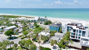 A coastal resort area with beachfront properties, a swimming pool, and a beach. - Luxury Pool and Rooftop Deck, Walk to Siesta Key Beach and Village! - Casa Siest (Siesta Key)