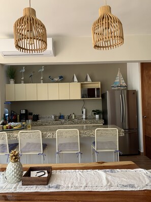 Fridge, microwave, stovetop, coffee/tea maker