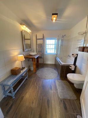 Bathtub, hair dryer, towels, soap