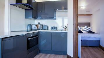 Apartment (1 Bedroom) | Private kitchen | Fridge, microwave, oven, stovetop