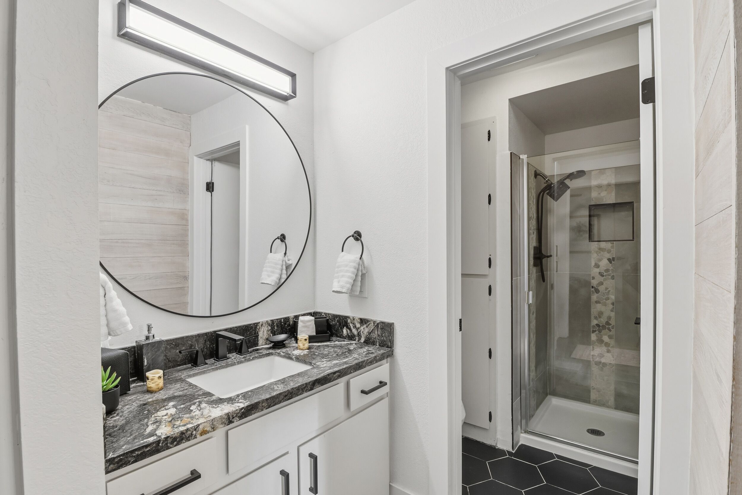 Shower, hair dryer, towels, soap