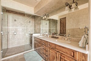 Bathtub, hair dryer, towels, soap