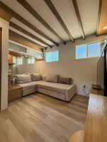 Exclusive Cabin | Living area | 55-inch Smart TV with cable channels