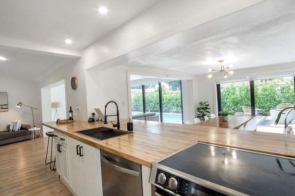 Beautiful butcher block counter for extra sitting and cooking