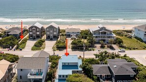 A coastal residential area with houses, a beach, and a clear view of the ocean. - Ocean View House, Steps to Beach, Pet Friendly, Linens & Beach Gear Provided (Surf City)