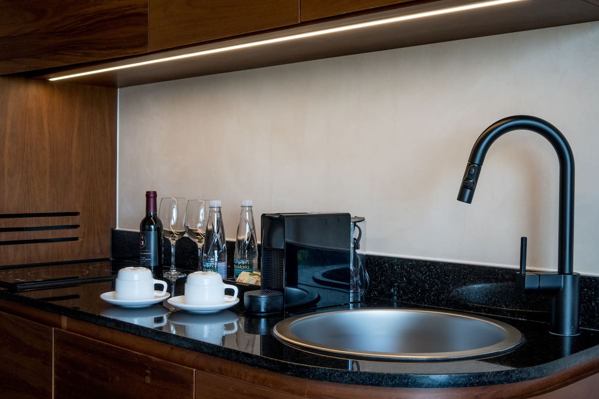 mini-fridge, espresso maker, cookware/dishes/utensils