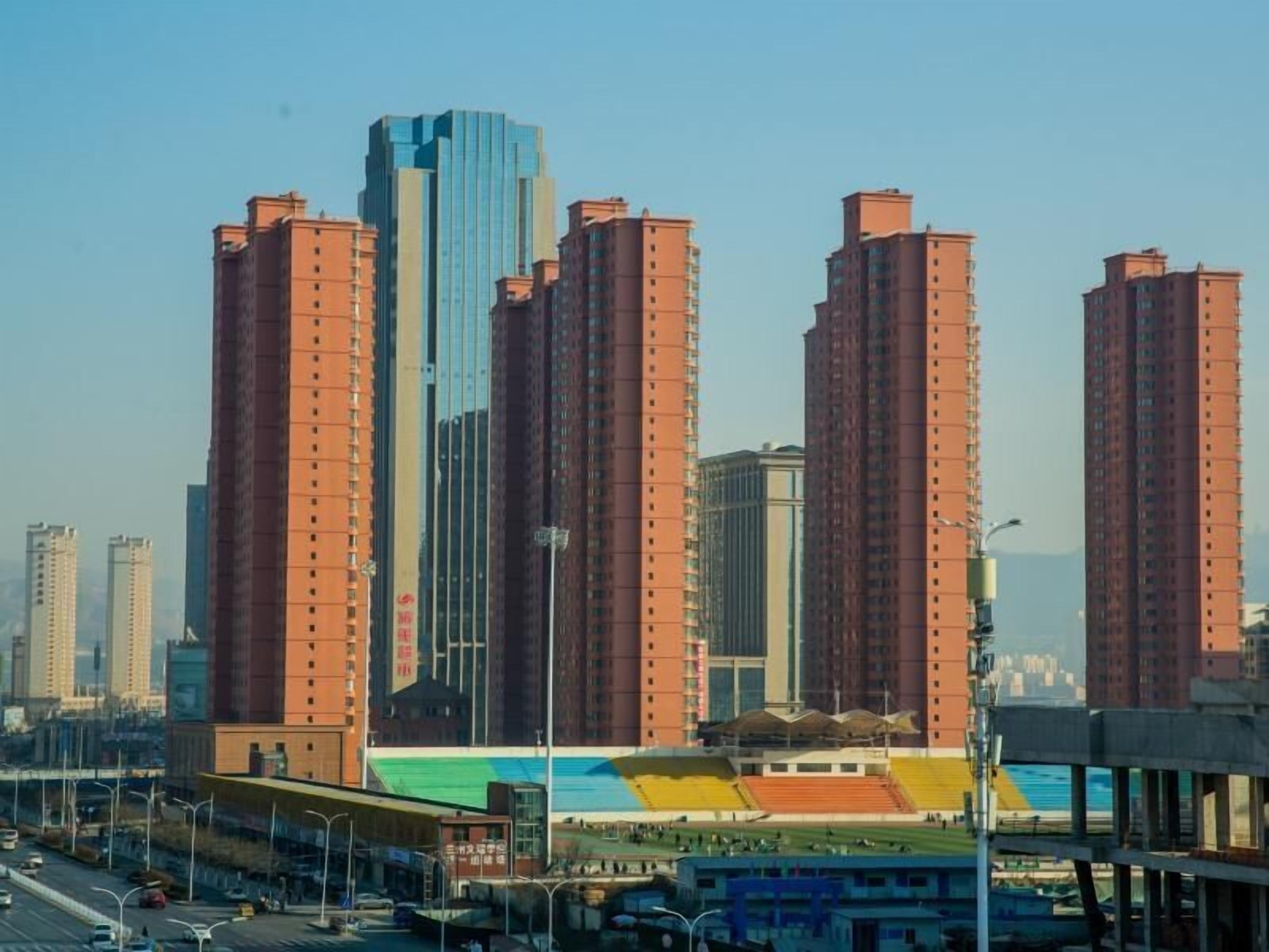 A high-rise building complex with multiple tall residential buildings.
