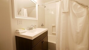 Bathtub, hair dryer, towels - 6 Bed 6 bath Country Red Brick Home (Eden)