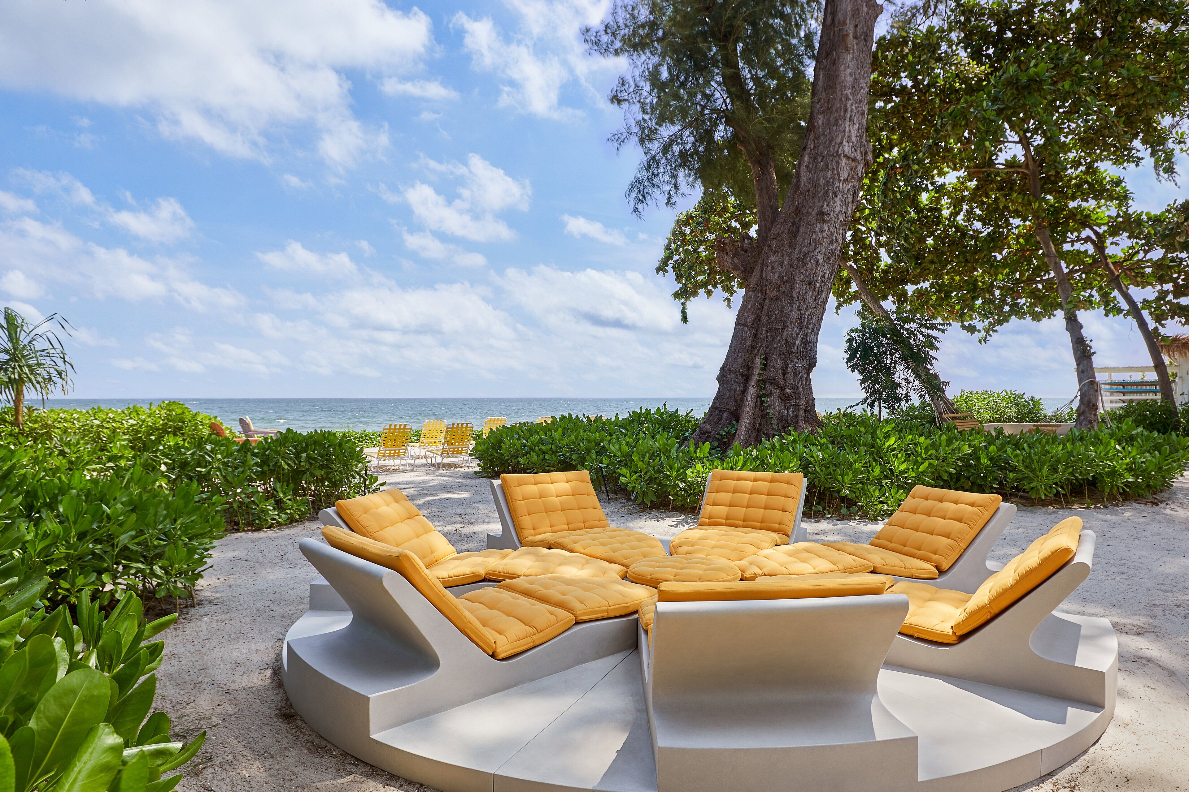 On the beach, white sand, beach umbrellas, beach towels
