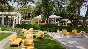 Outdoor pool, open 7:00 AM to 8:00 PM, free pool cabanas, pool umbrellas