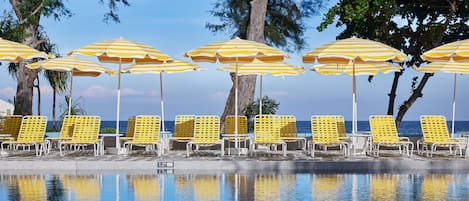 Outdoor pool, open 7:00 AM to 8:00 PM, free pool cabanas, pool umbrellas