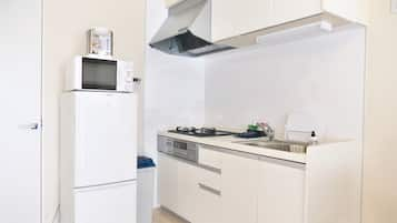 Apartamento família, para não fumantes | Cozinha privada | Geladeira, micro-ondas, cooktop, chaleira elétrica