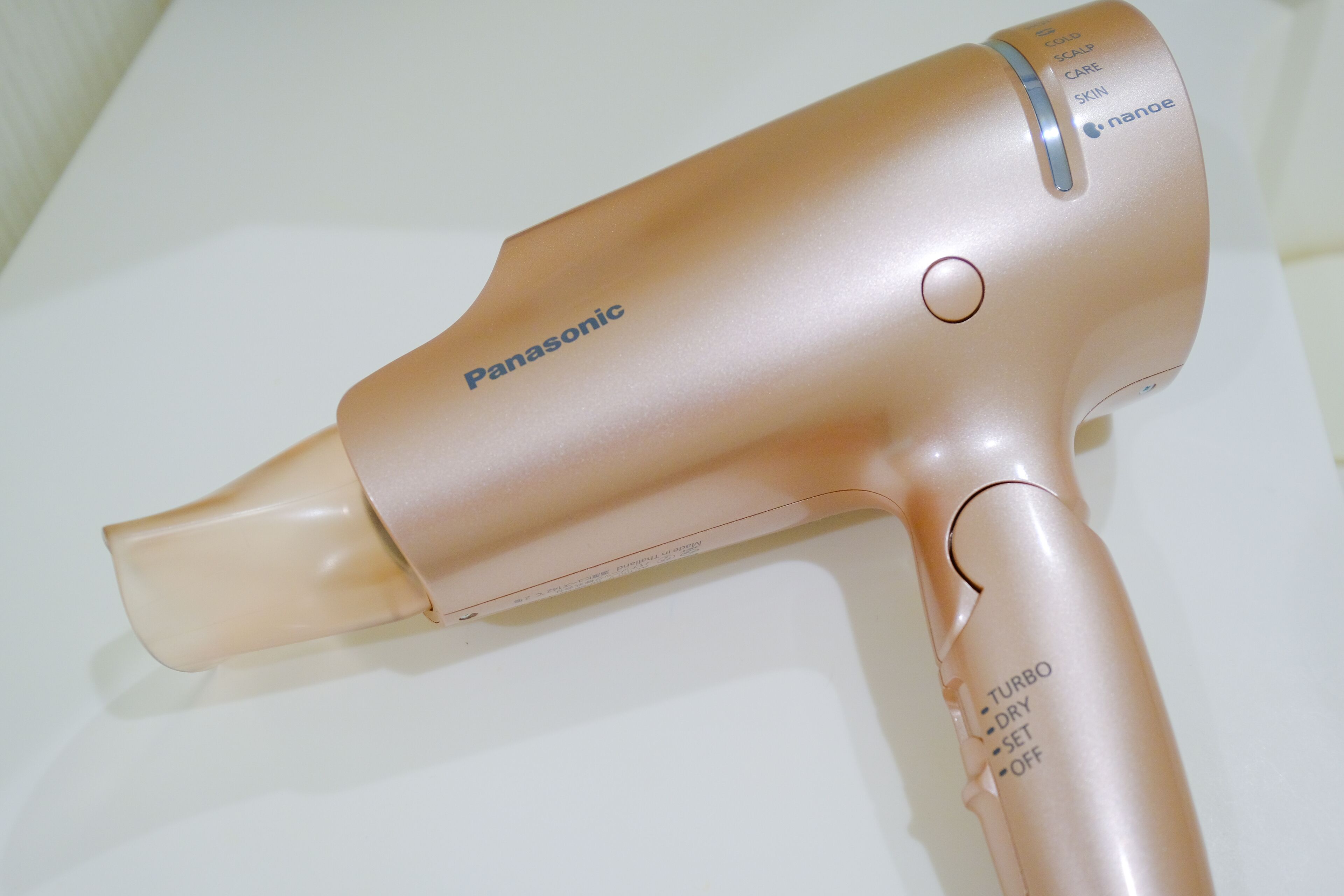 A Panasonic hair dryer with a metallic finish.