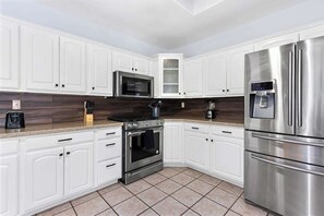 Fridge, stovetop, coffee/tea maker, toaster