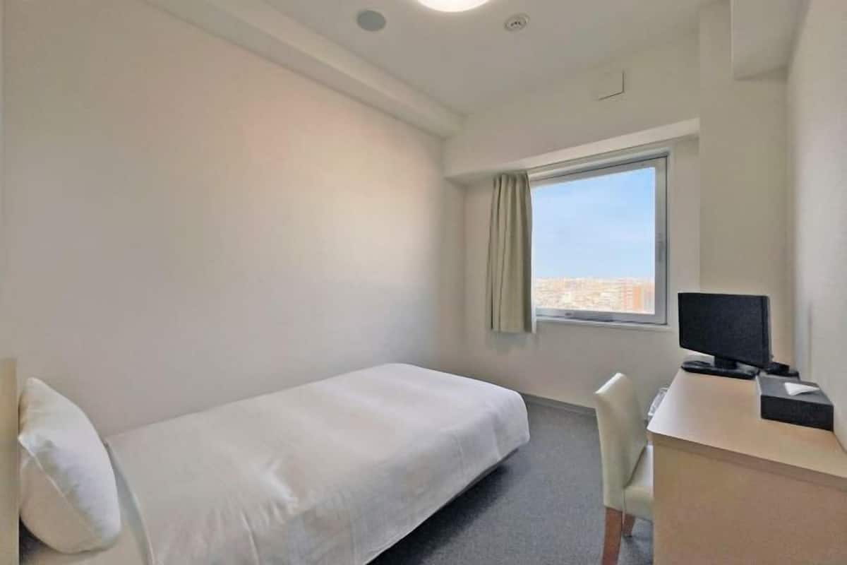 Down duvets, laptop workspace, blackout curtains, iron/ironing board