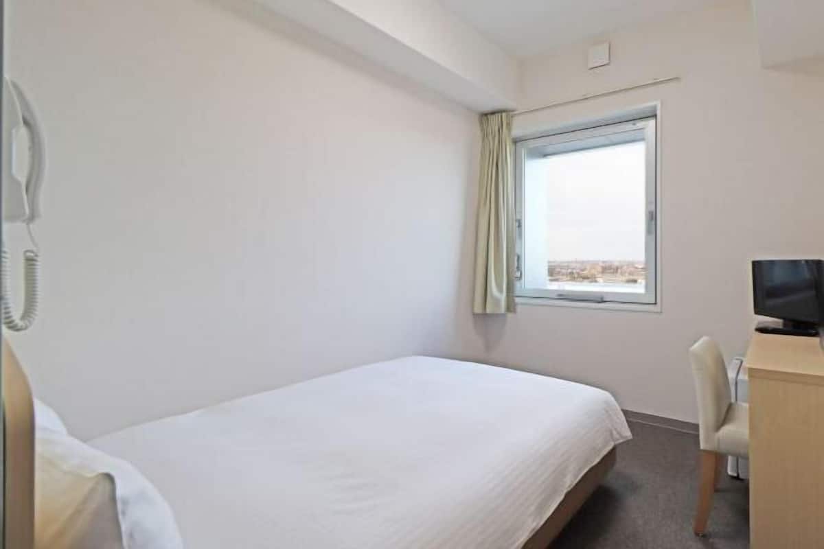 Down duvets, laptop workspace, blackout curtains, iron/ironing board